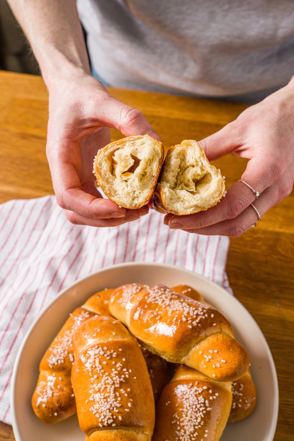 The Salt Bread — Korean crescent roll torn open to show the butter-layered interior