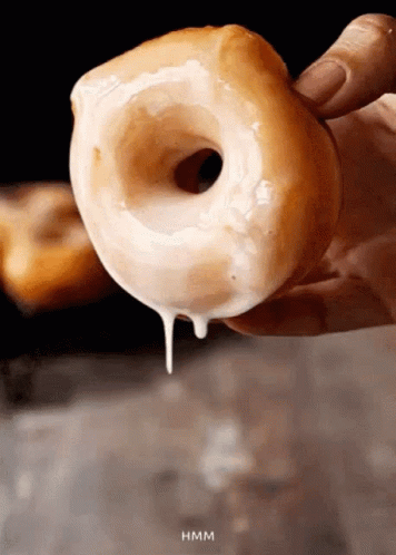 The Ring — a glazed doughnut held up with glaze dripping down
